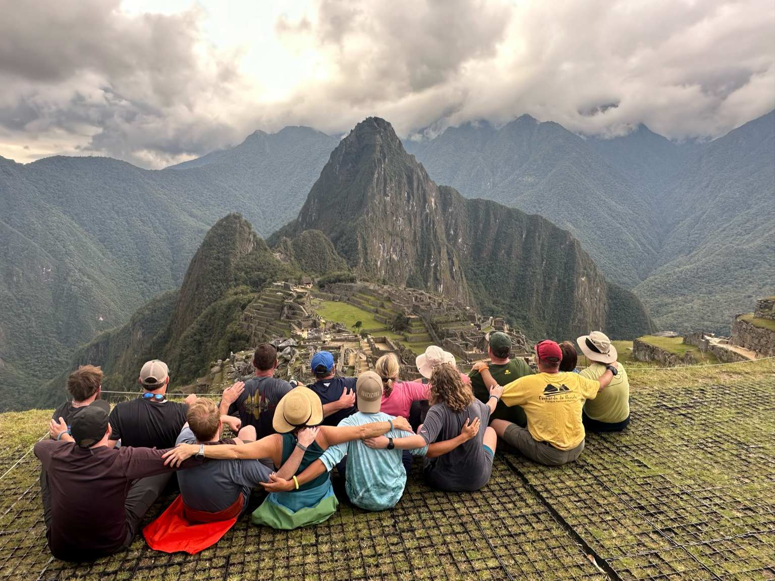 Kathy and fellow travelers overlooking Machu Picchu